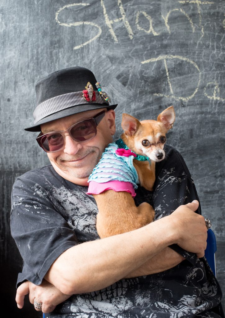 Photo of Juan Pablo Gutiérrez holding his small dog Malena